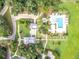 Aerial view of community pool with cabanas, sun loungers, fire pit and manicured landscaping at 109 Goose Rd, Summerville, SC 29483