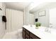 Modern bathroom with double vanity, neutral color palette, and a shower-tub combination at 109 Goose Rd, Summerville, SC 29483