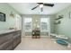 Spacious bedroom with green walls, neutral carpet, and a changing table at 109 Goose Rd, Summerville, SC 29483