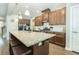 Kitchen with an island that includes seating, stainless steel appliances, granite countertops, and wooden cabinets at 109 Goose Rd, Summerville, SC 29483