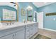Bathroom featuring double sinks, quartz counters, modern fixtures, and plenty of natural light at 1100 Griswold St, Mount Pleasant, SC 29466