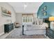 This bedroom boasts a color accent wall, complemented by elegant decor and a spacious bed at 1100 Griswold St, Mount Pleasant, SC 29466
