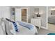 Charming bedroom with a queen-size bed, stylish decor, and an attached bathroom at 1100 Griswold St, Mount Pleasant, SC 29466