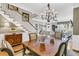 Dining room with a chandelier, dining table, and stairs at 1100 Griswold St, Mount Pleasant, SC 29466