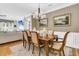 Elegant dining room featuring a hardwood table, chandelier, and access to the living area at 1100 Griswold St, Mount Pleasant, SC 29466