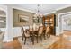 Dining room featuring hardwood floors, table with seating, and a decorative china cabinet at 1100 Griswold St, Mount Pleasant, SC 29466