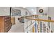 An open second-floor hallway with beautiful banister, leading to comfortable living spaces at 1100 Griswold St, Mount Pleasant, SC 29466