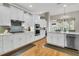Bright kitchen featuring white cabinets, stainless steel appliances, and a large island with a sink and dishwasher at 1100 Griswold St, Mount Pleasant, SC 29466