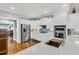 Spacious kitchen showcasing stainless steel appliances, granite countertops, and a large island with a sink at 1100 Griswold St, Mount Pleasant, SC 29466