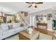 Spacious living room featuring hardwood floors, staircase, and comfortable sofa at 1100 Griswold St, Mount Pleasant, SC 29466