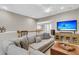 Comfortable living room with a sectional sofa, ceiling fan, and natural light at 1100 Griswold St, Mount Pleasant, SC 29466