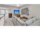 Inviting living room with neutral tones, plush seating, and a gallery wall for a cozy yet sophisticated atmosphere at 1100 Griswold St, Mount Pleasant, SC 29466
