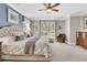 Bright main bedroom featuring a ceiling fan, large windows and a sitting area for relaxation at 1100 Griswold St, Mount Pleasant, SC 29466