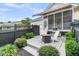 Outdoor patio featuring a fire pit, chairs, and screened in deck, perfect for entertaining at 1100 Griswold St, Mount Pleasant, SC 29466