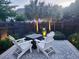 Serene patio with Adirondack chairs, a fire pit, and ambient lighting creating a cozy evening retreat at 1100 Griswold St, Mount Pleasant, SC 29466