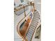 Elegant staircase with hardwood treads, white risers, and a flowing design at 1100 Griswold St, Mount Pleasant, SC 29466