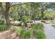 Beautiful manicured landscape in a park-like setting with tennis courts in the background at 1100 Griswold St, Mount Pleasant, SC 29466