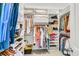 Well-organized walk-in closet with ample storage space and custom shelving at 1100 Griswold St, Mount Pleasant, SC 29466