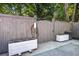 Backyard with gray fencing, planter boxes, and a built-in EV charger at 1126 Brigantine Dr, Charleston, SC 29412