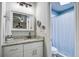 Bathroom with white cabinets, gray granite counter tops, and a view of the shower at 1126 Brigantine Dr, Charleston, SC 29412