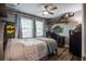 bedroom with ceiling fan, hardwood floors, decorative shelves, neutral walls and natural light at 1126 Brigantine Dr, Charleston, SC 29412
