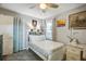 Bright bedroom featuring a ceiling fan, bedside decor, a comfy bed, and natural light streaming through the window at 1126 Brigantine Dr, Charleston, SC 29412