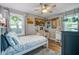 Bedroom with a white bed, desk and view of two windows at 1126 Brigantine Dr, Charleston, SC 29412