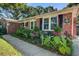 Brick home exterior with well-maintained landscaping and traditional details at 1126 Brigantine Dr, Charleston, SC 29412