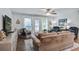 Comfortable living room with a ceiling fan, three windows for natural light and ample seating at 1126 Brigantine Dr, Charleston, SC 29412