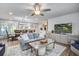 Open concept living space with stylish furniture, area rug, and a view of the dining room and kitchen at 1126 Brigantine Dr, Charleston, SC 29412