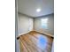 Bedroom featuring hardwood flooring and natural light from a window at 114 Madison St, Walterboro, SC 29488