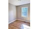 Bedroom with hardwood flooring and a window with a view of trees at 114 Madison St, Walterboro, SC 29488