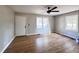 Bright living room with hardwood floors, fresh paint, new ceiling fan, and large windows at 114 Madison St, Walterboro, SC 29488