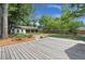 Large backyard featuring mature trees, a wooden fence, and a detached three car garage at 1260 Old Whitesville Rd, Moncks Corner, SC 29461