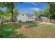 Expansive backyard featuring a home with a deck, swing set, and three car garage at 1260 Old Whitesville Rd, Moncks Corner, SC 29461