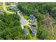 An aerial view of home in wooded community close to waterfront and cul-de-sac at 129 Martins Point Dr, Wando, SC 29492