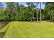 Spacious backyard with lush green grass, fenced perimeter, and mature trees for privacy at 129 Martins Point Dr, Wando, SC 29492