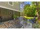 Backyard patio with a stock tank pool and comfortable seating surrounded by lush greenery at 129 Martins Point Dr, Wando, SC 29492