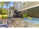 Inviting backyard patio with a stock tank pool, outdoor seating, and lush greenery at 129 Martins Point Dr, Wando, SC 29492