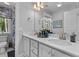 A bathroom featuring a double sink vanity, modern fixtures, and a window offering natural light at 129 Martins Point Dr, Wando, SC 29492