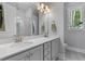 Bright bathroom featuring double sinks, modern lighting, and a window view at 129 Martins Point Dr, Wando, SC 29492