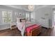 Charming bedroom with shuttered windows, elegant decor, and hardwood floors at 129 Martins Point Dr, Wando, SC 29492