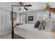 Bedroom features a four-poster bed, neutral walls, and natural light with a decorative deer head at 129 Martins Point Dr, Wando, SC 29492