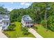 Charming two-story home with a welcoming front porch, lush landscaping, and a well-manicured lawn at 129 Martins Point Dr, Wando, SC 29492