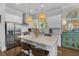 Well-appointed kitchen featuring stainless steel appliances and a center island with bar stool seating at 129 Martins Point Dr, Wando, SC 29492