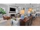 Comfortable living room featuring a fireplace, hardwood floors, and open-concept layout at 129 Martins Point Dr, Wando, SC 29492