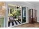 Inviting screened porch with comfortable seating and view of wooded backyard at 129 Martins Point Dr, Wando, SC 29492