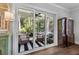 Bright and airy screened porch featuring comfortable furniture and scenic outdoor views at 129 Martins Point Dr, Wando, SC 29492