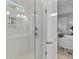 Modern shower with glass door and white subway tile, adjacent to the bedroom at 129 Martins Point Dr, Wando, SC 29492