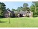 Lovely brick home with a well-kept lawn, highlighting its charming details and inviting curb appeal at 1457 Green Pond Hwy, Walterboro, SC 29488
